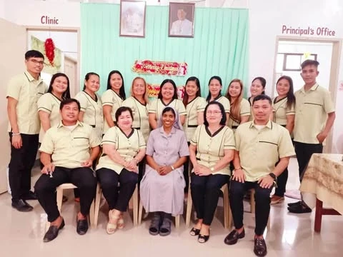 Sisters and community members gathered for a group photograph